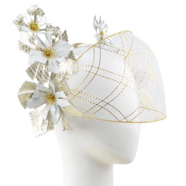 White headpiece with gold accents and floral decorations on a white background