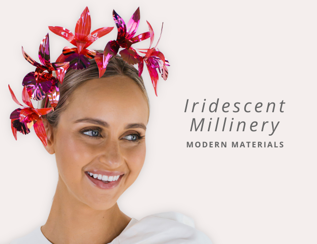 Woman wearing a colorful iridescent millinery headpiece with text 'Iridescent Millinery Modern Materials' on a white background.