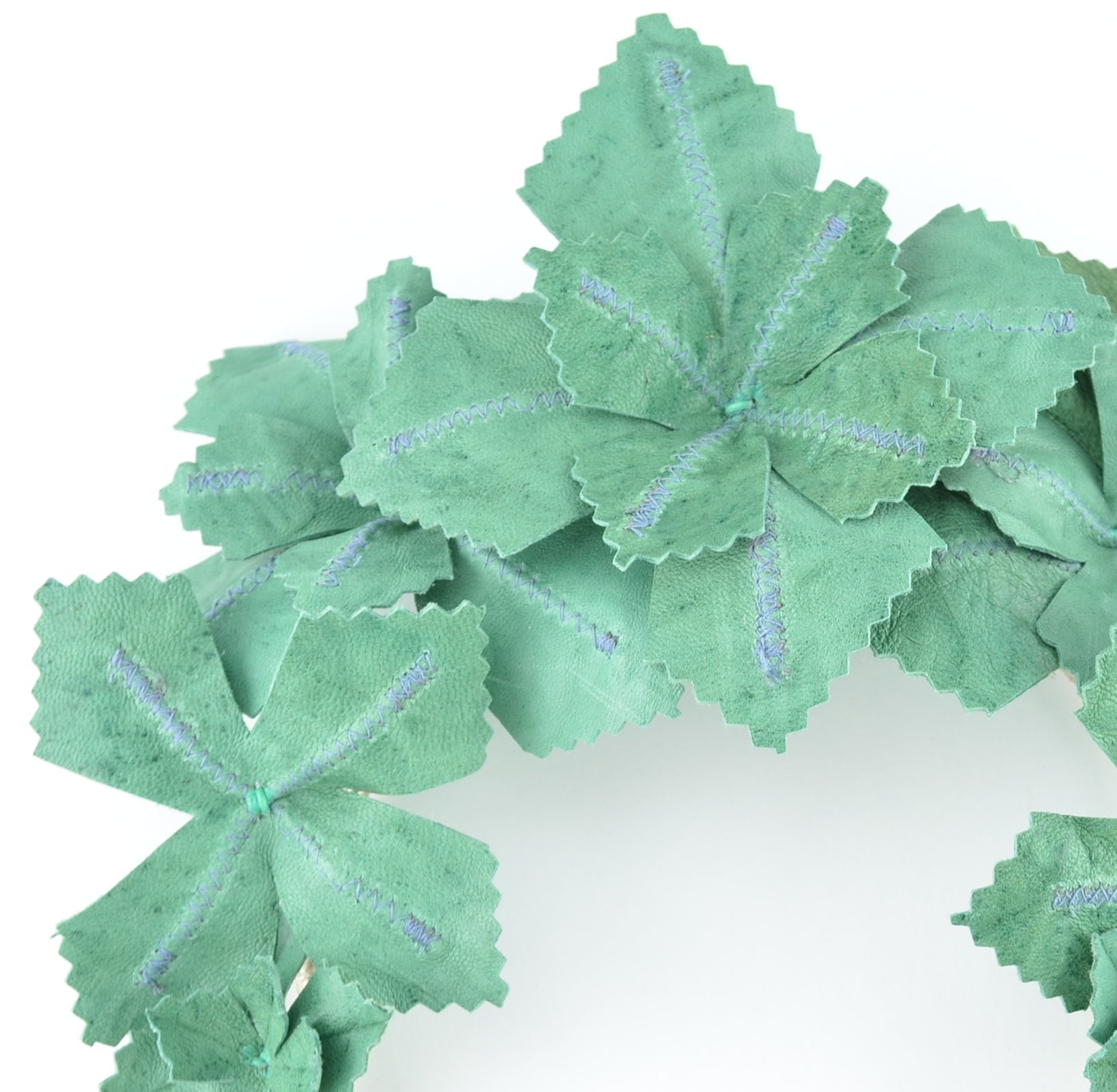 Green leafy headband on a white background